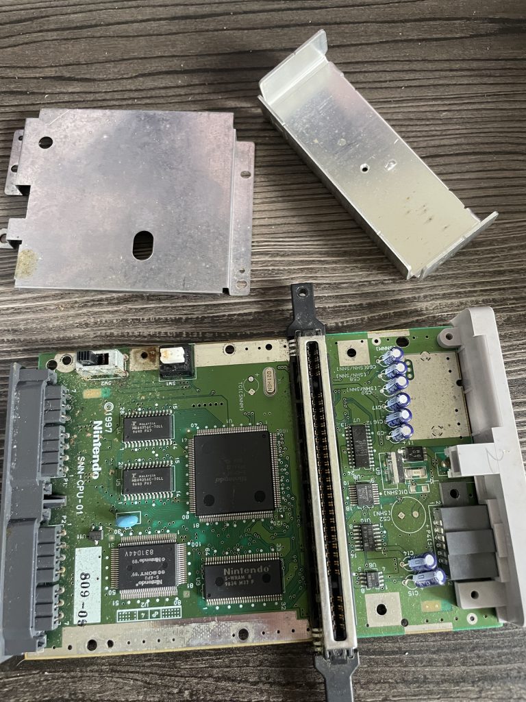 The SNES Jr. motherboard. The RF shields have been removed.