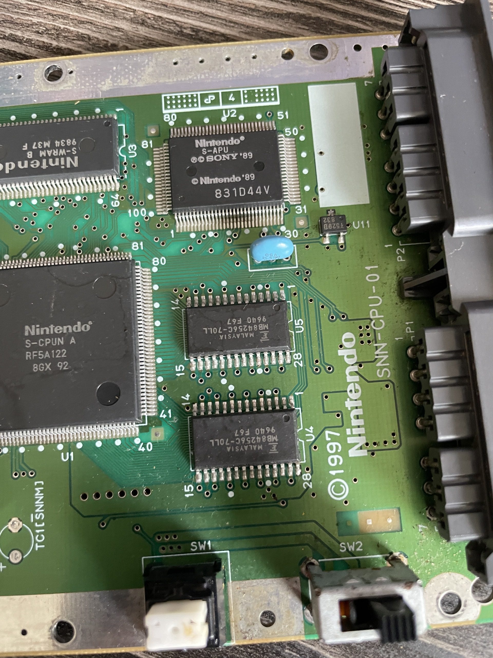The half of the SNES Jr. motherboard with the controller ports.