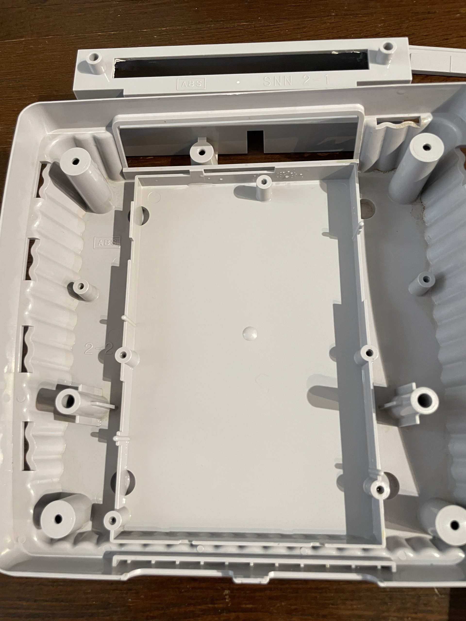 The inside of the bottom of the SNES Jr. shell, after cleaning