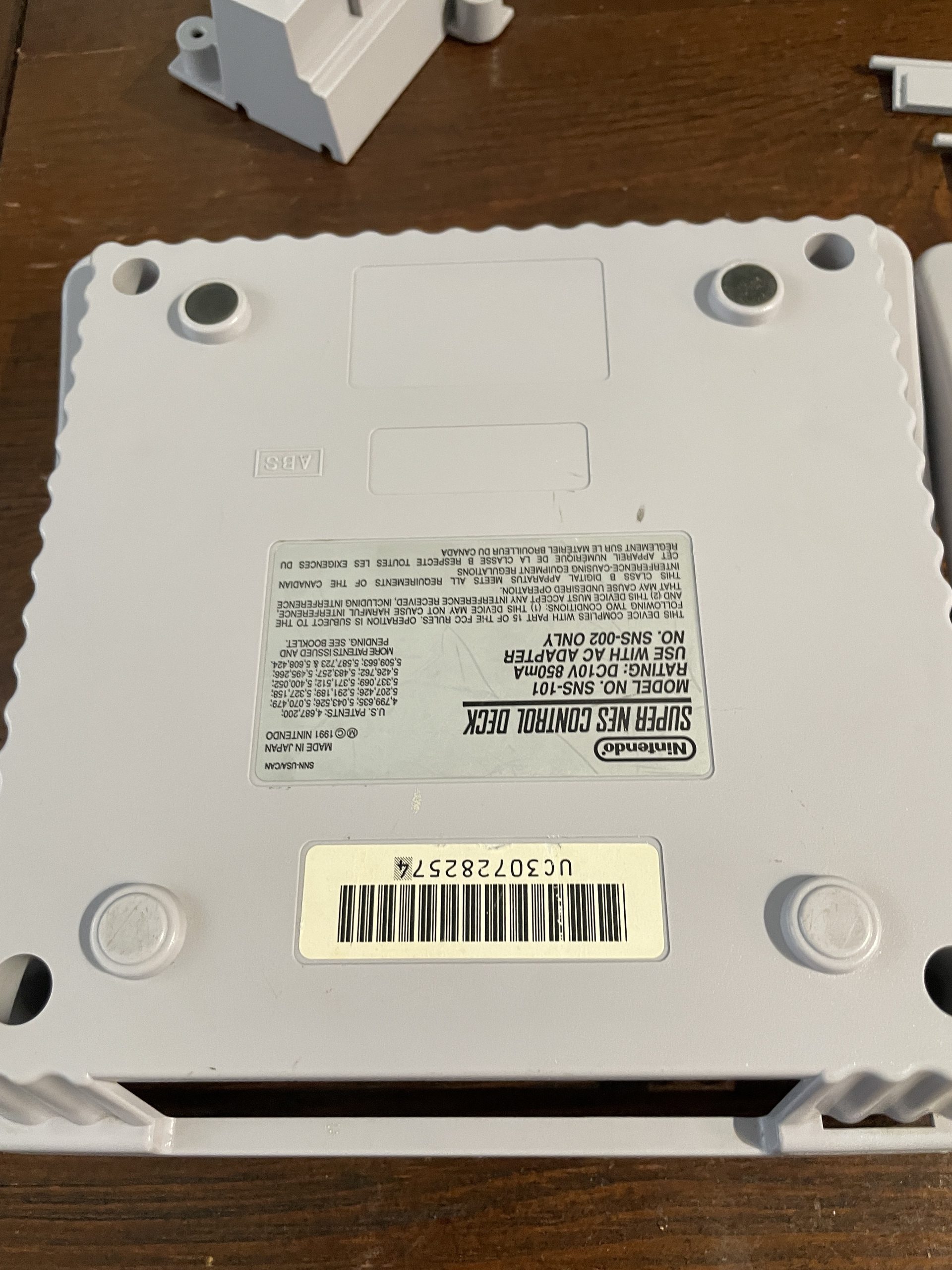 The underside of the bottom of the SNES Jr. shell, after cleaning